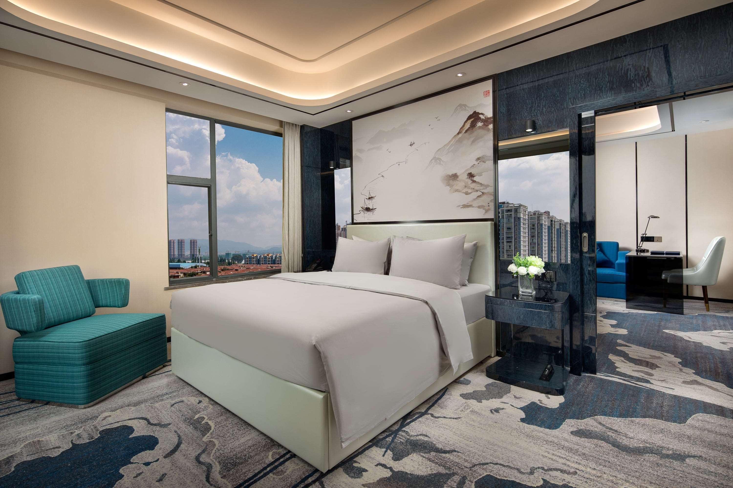 Ramada By Wyndham Mengzi Suites Esterno foto